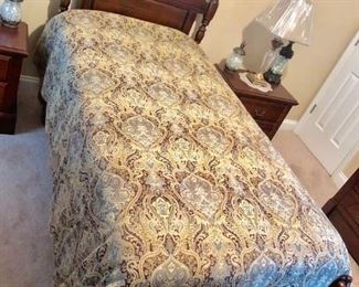 Twin bed and another chest of drawers in this room complement each other well