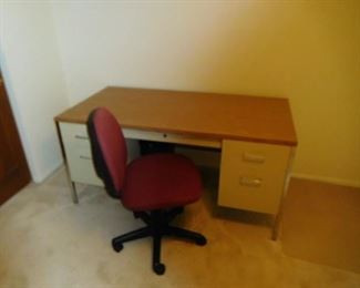 metal  desk  and   red  desk  chair