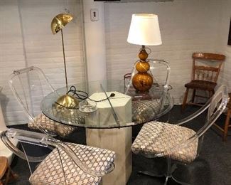 Round glass table and lucite chairs 