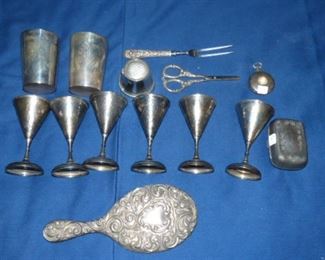 Sterling cups, mirror, serving fork, scissors and packet watch case.