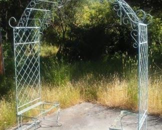 vintage iron arbor with garden seats