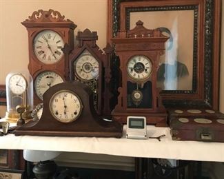 Large selection of antique clocks, 2 Waterbury Clocks both working, 2 Session Mantle Clocks, 1 working, 1 Ithica Calendar Clock, non working, and 1 Tiffany neverwind clock, the dome is cracked.