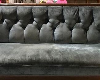 Victorian tufted sofa with carved face