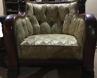 Victorian tufted arm chair with carved face