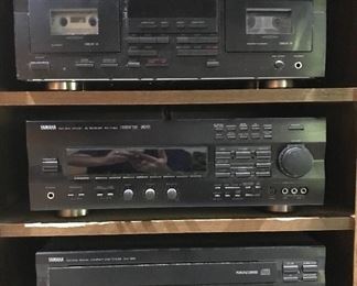 Bookshelf with Yamaha electronic equipment:  KX-W392 cassette deck; AV Receiver RX-V793; CD Player CDC-665