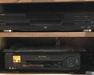 Bookshelf with DVD-1000 player; Sony VCR plus player