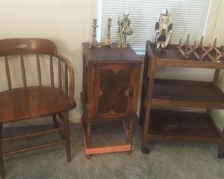 Oak captain's chair, oak cabinet, 3 tier oak cart on wheels, fisherman nutcracker, brass Viking figurine