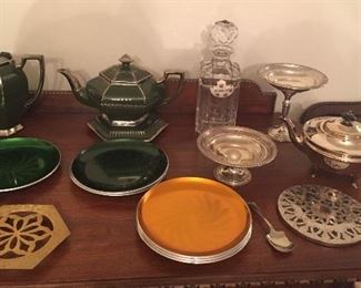 Teapots, Atlantis crystal decanter, sterling candy dishes, Sheffield silverplate teapot, Olden colored aluminum plates (Norway)