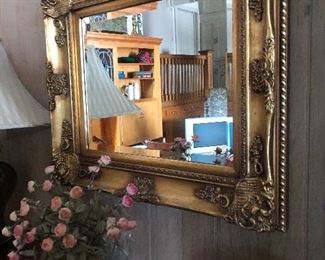 Gilded frame beveled glass mirror. 