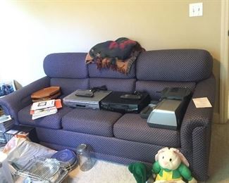Sofa and a lot of miscellaneous office supplies 