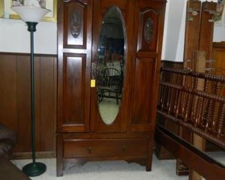 Oval mirror armoire