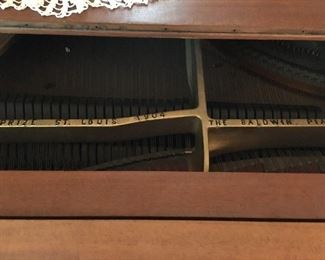 1900 Grand Prix  Baby Grand piano . Was purchased by a father for his daughter when she was a little girl. This piano had won several awards including an award at the 1904 ST Louis World Fair. My client bought later from lady and has owned it since. Taken several pictures for your convivence.