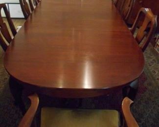 Hinkle-Harris dining room table. Wild cherry and includes eight chairs, two additional leaves and pads.