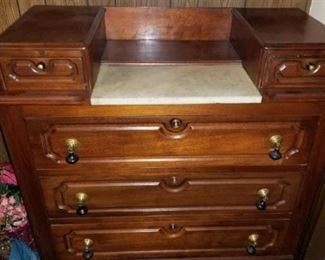 Another marble top dresser without mirror.