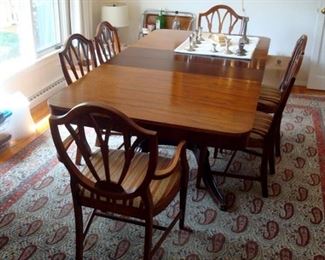 Vintage Duncan Phyfe  dining table and set of shield back chairs. 