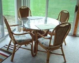 Rattan table & four chairs.