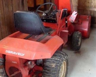 Gravely lawn tractor with snow thrower and mower.