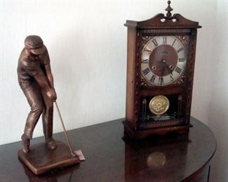 Centurion clock and bronzed plaster figurine.