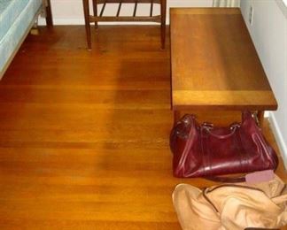 Two mid century tables and leather bags.