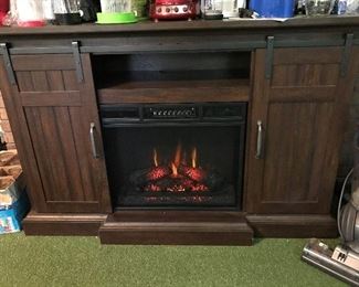 Electric Fireplace with sliding barn door style media cabinet.