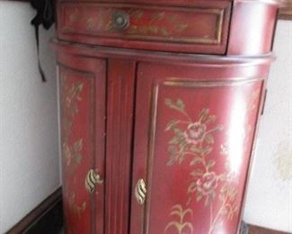 BURGUNDY COMMODE WITH HANDPAINTED DETAIL