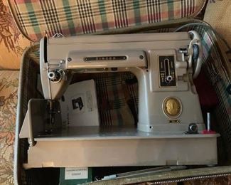 #10	Singer sewing machine 301 has metal bobbin case 	 $75.00 
