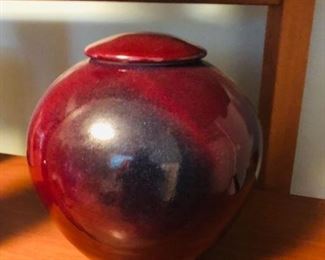 Red pottery bowl with lid.  