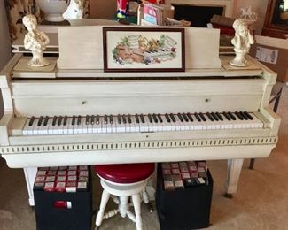 Estey player piano, stool and piano rolls