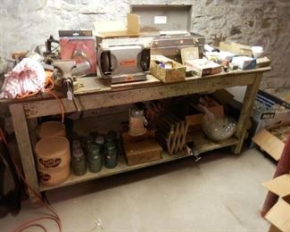 old farm table, tools, tins, blue canning jars