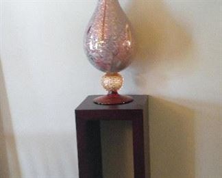 One of pair of hand blown glass jars