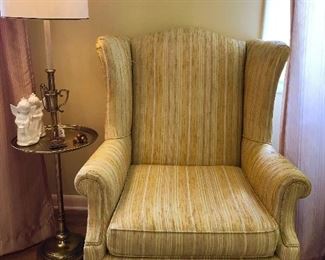 Vintage yellow Queen Anne chair,  brass floor lamp and decor.