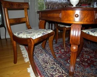 Turn of the century extension-type dining table, 91" long; includes four leaves and eight matching chairs