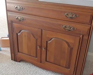 Saginaw Table extendable table six leaves. Cabinet with silver drawer. 