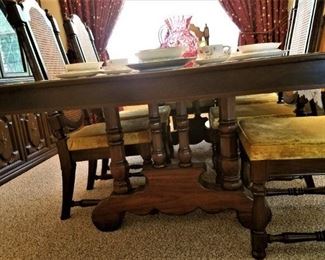 Beautiful base of dining table that seats 12 when leaf in.  Vintage gold crushed velvet seats on 8 dining chairs (not all pictured).