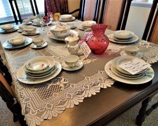 DIning table top without leaf in.  Colored glasses at far end of table not available.  "Sweet Pea" china from Japan - 12 place settings plus serving pieces available.  
