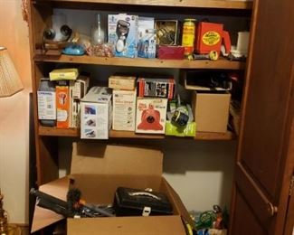 Corningware and gardening items, tools etc.  some new in boxes.  Halloween and Thankgiving items are in this closet in garage too.