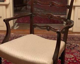 Two matching Arm Chairs for the dining room set. Wonderful wood carving on these.