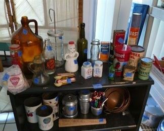 grandma's favorite kitchen items, top two shelves. delightful collection of vintage tins on the bottom. 