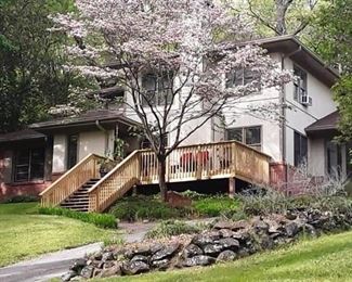 Repainted House with blooming dogwood
