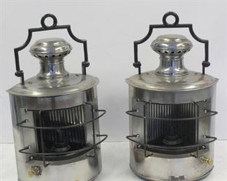 A Pair Of Polished Metal Ships Lanterns