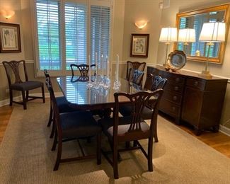 2. DINING ROOM TABLE (64" x 44" x 29.5" NOT INCLUDING 2 LEAVES) WITH GLASS TOP, CUSTOM TABLE PADS, & 2 EXTRA LEAVES. INCLUDES 8 CHAIRS (21" x 18" x 36"). EASILY SEATS 10-12.  (CANDLES HOLDERS/CANDLES NOT INCLUDED)