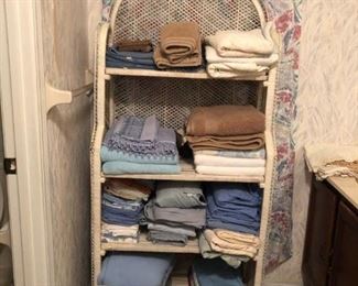 Wicker shelf with towels