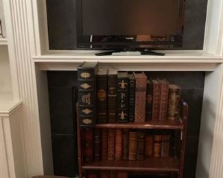 flat screen tv and old books