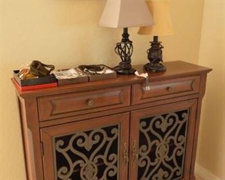 Small side table with metal guard.