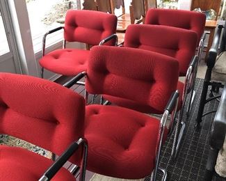 Eight red Steelcase cantilevered chairs