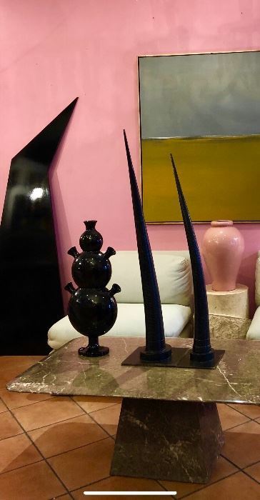 This home is chock full of 70’s and 80’s goodness. This grey marble coffee table is a dream. Large abstract painting / artist is Luc Leestaker . Large Sculptural Geometric Piece -custom designed , hangs on the wall. Stunning pieces 