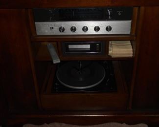 Early American style side board w/2 doors and built in Magnavox tuner, 8 track player & turn table
