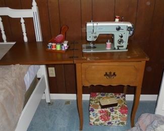 Vintage 'Artcraft' sewing machine in cabinet