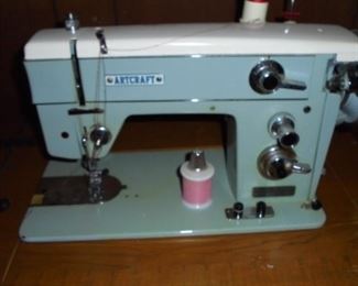 Vintage 'Artcraft' sewing machine in cabinet