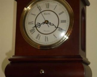 Bulova mantle clock in wooden cabinet